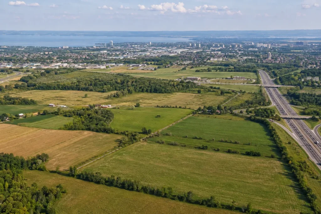 Farm fields near Barrie with Highway 400 and Lake Simcoe in the distance